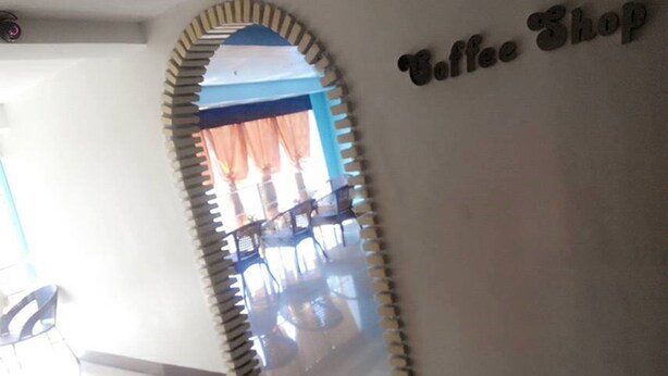 An interior corridor with a sign reading "Coffee Shop" on the wall. - Asia Novo Boutique Hotel - Dumaguete (Dumaguete)