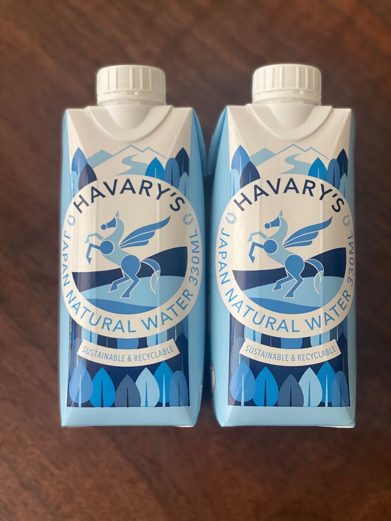 Two cartons of Havary's Natural Water, labeled as sustainable and recyclable.