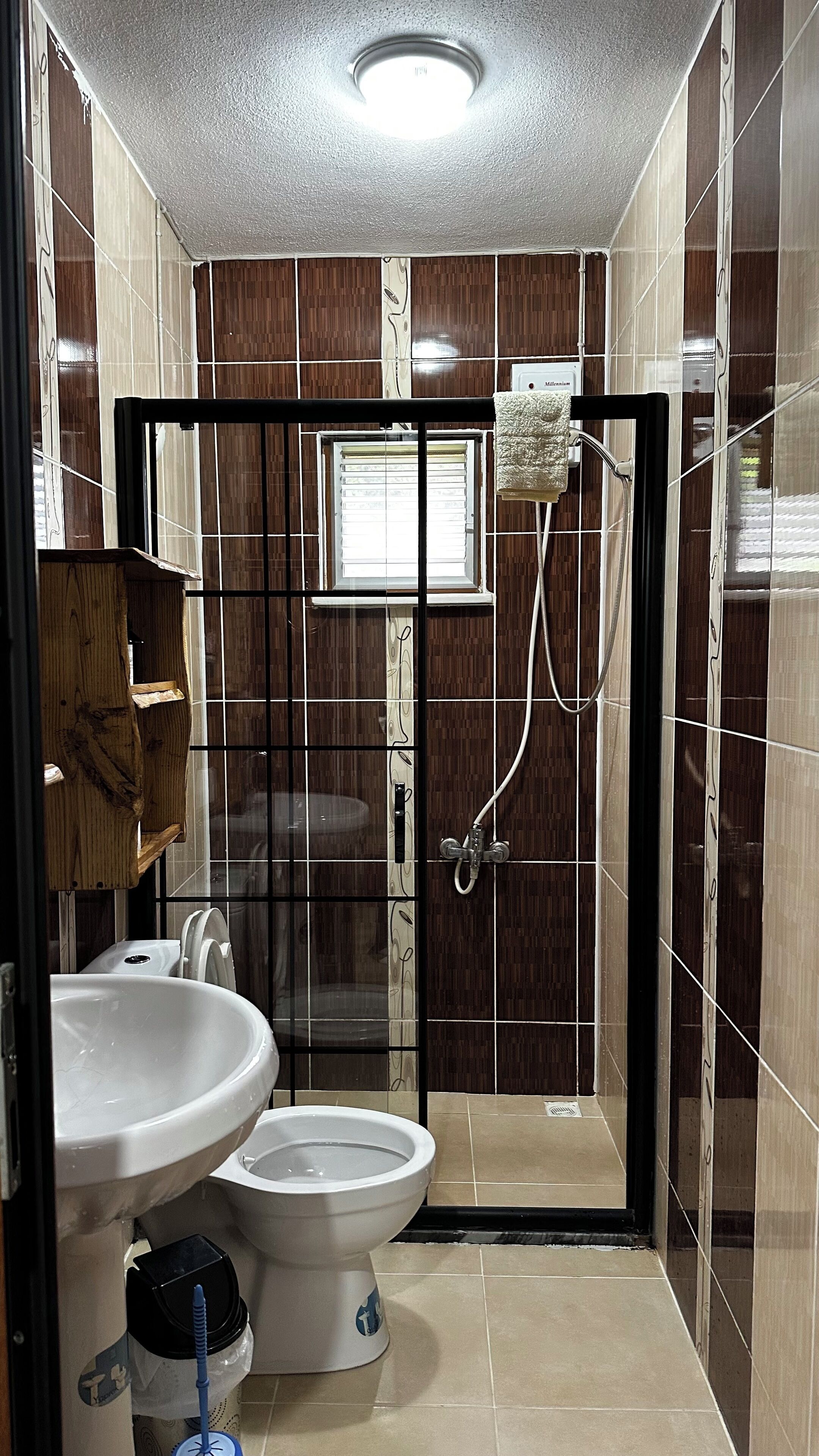A bathroom with a toilet, bidet, and sink.