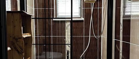 A bathroom with a toilet, bidet, and sink.