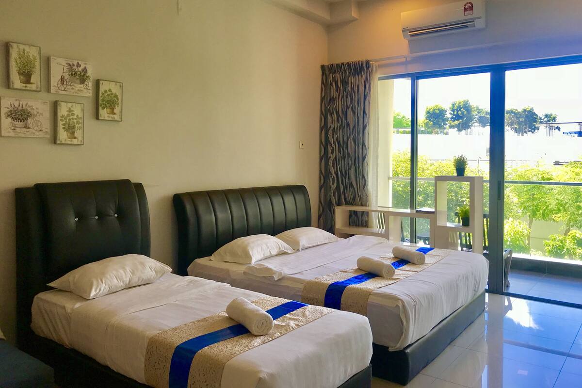 Deluxe Studio Suite, Multiple Beds, Balcony, Garden View | Desk, laptop workspace, soundproofing, iron/ironing board