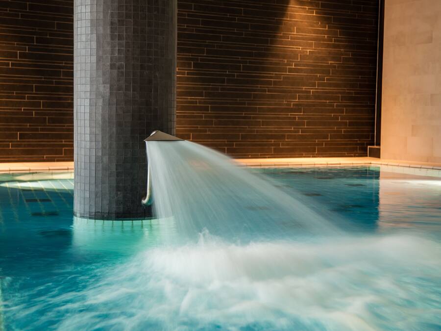 Indoor pool, open 7:00 AM to 10:00 PM, pool loungers