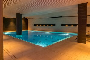 Indoor pool, open 7:00 AM to 10:00 PM, pool loungers