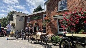 A brick building with a sign reading "RIDLEYS ALE AND STOUT". - The Compasses Inn (Chelmsford)