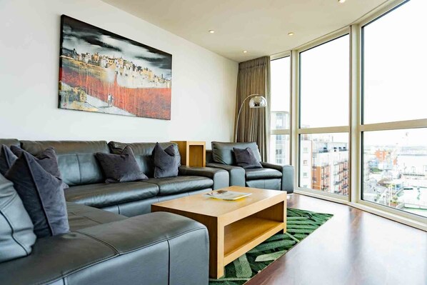 Superior Apartment, 2 Bedrooms, Kitchen, City View | Living area | Flat-screen TV, heated floors