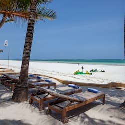 On the beach, white sand, sun-loungers