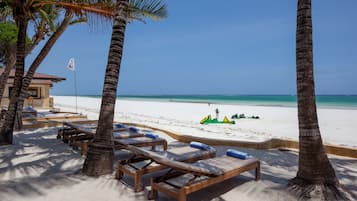 On the beach, white sand, sun loungers