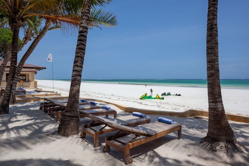 On the beach, white sand, sun loungers