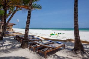 On the beach, white sand, sun-loungers - Blue Marlin Beach Hotel  (Diani Beach)