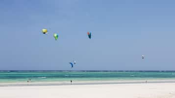 On the beach, white sand, sun loungers