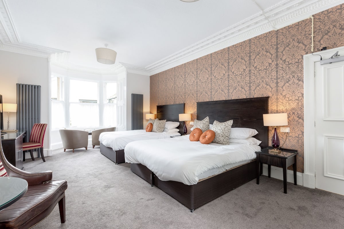 superior quadruple room, ensuite, garden view | individually decorated, desk, laptop workspace, blackout curtains