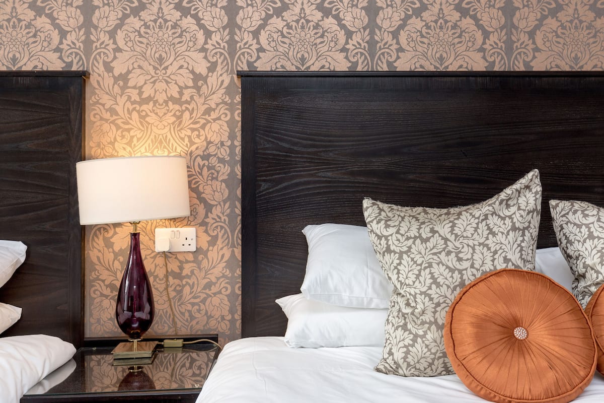 superior quadruple room, ensuite, garden view | individually decorated, desk, laptop workspace, blackout curtains