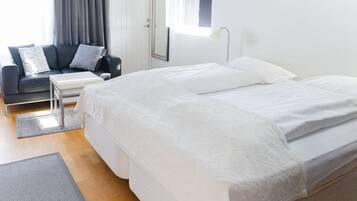 Junior Triple Room, Private Bathroom | Blackout drapes, free WiFi, bed sheets