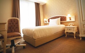 Premium bedding, down comforters, free minibar items, in-room safe