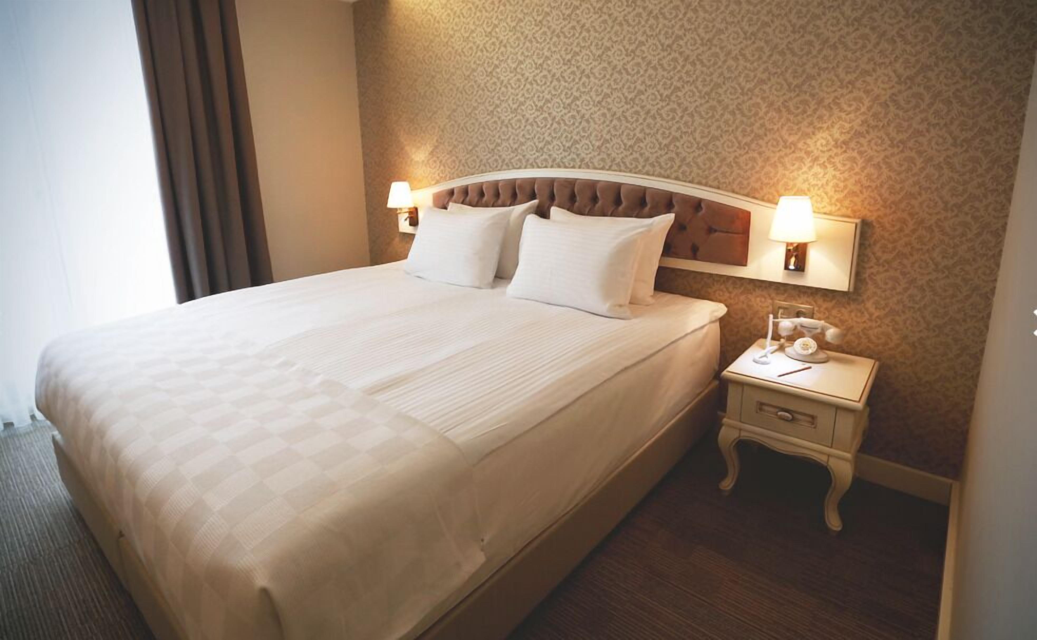 Chambre Triple Deluxe, vue mer | Literie de qualité supérieure, couette en duvet d'oie