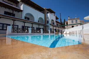 Outdoor pool, open 9:00 AM to 9:00 PM, pool umbrellas, sun loungers