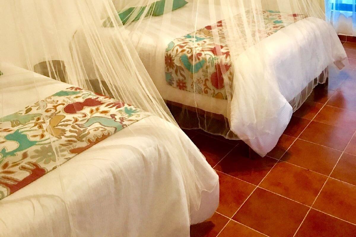 Deluxe Room, 2 Double Beds | Iron/ironing board (on request), WiFi (free)