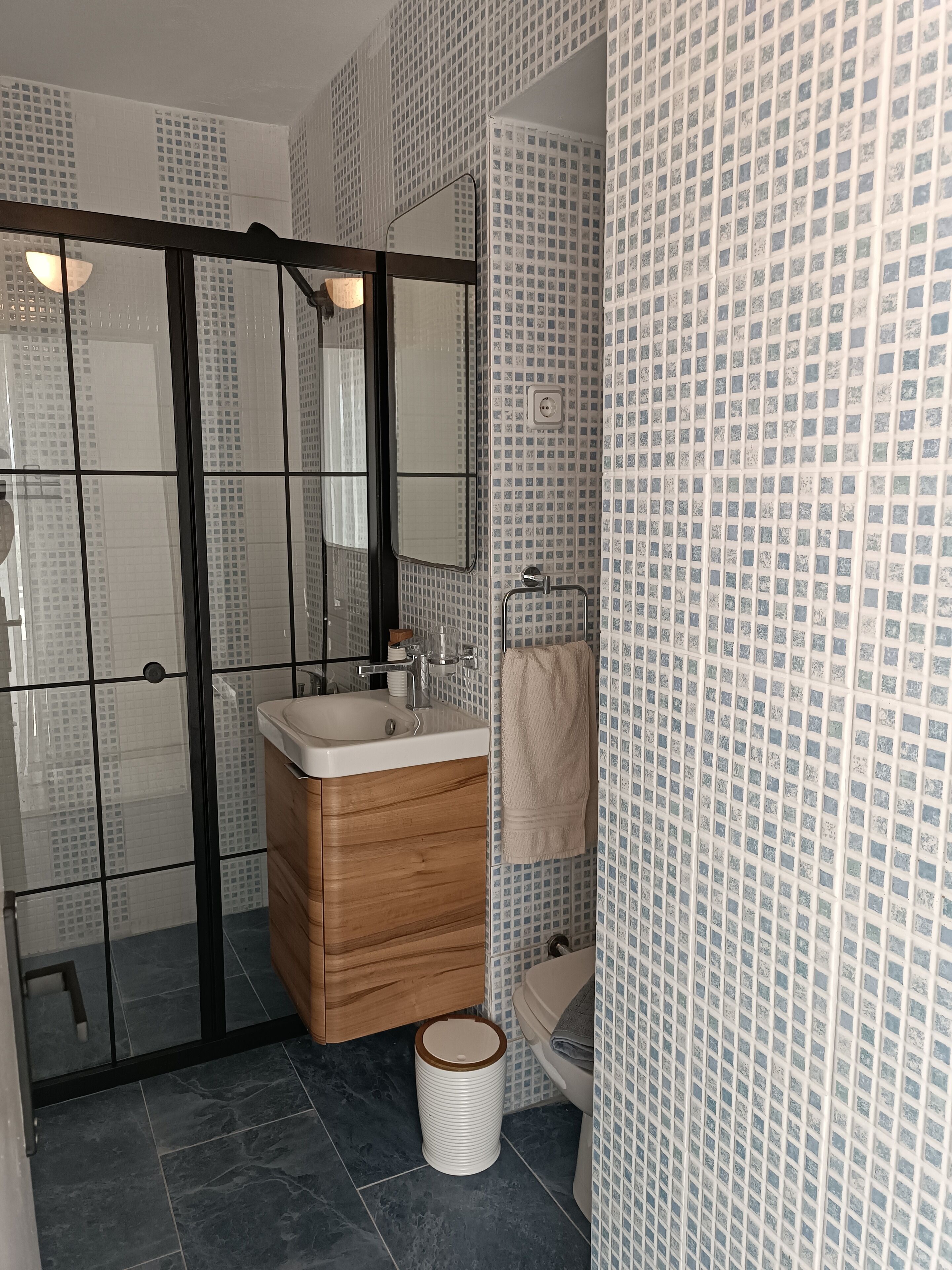 economy room, garden view | bathroom | shower, hair dryer, bathrobes, slippers