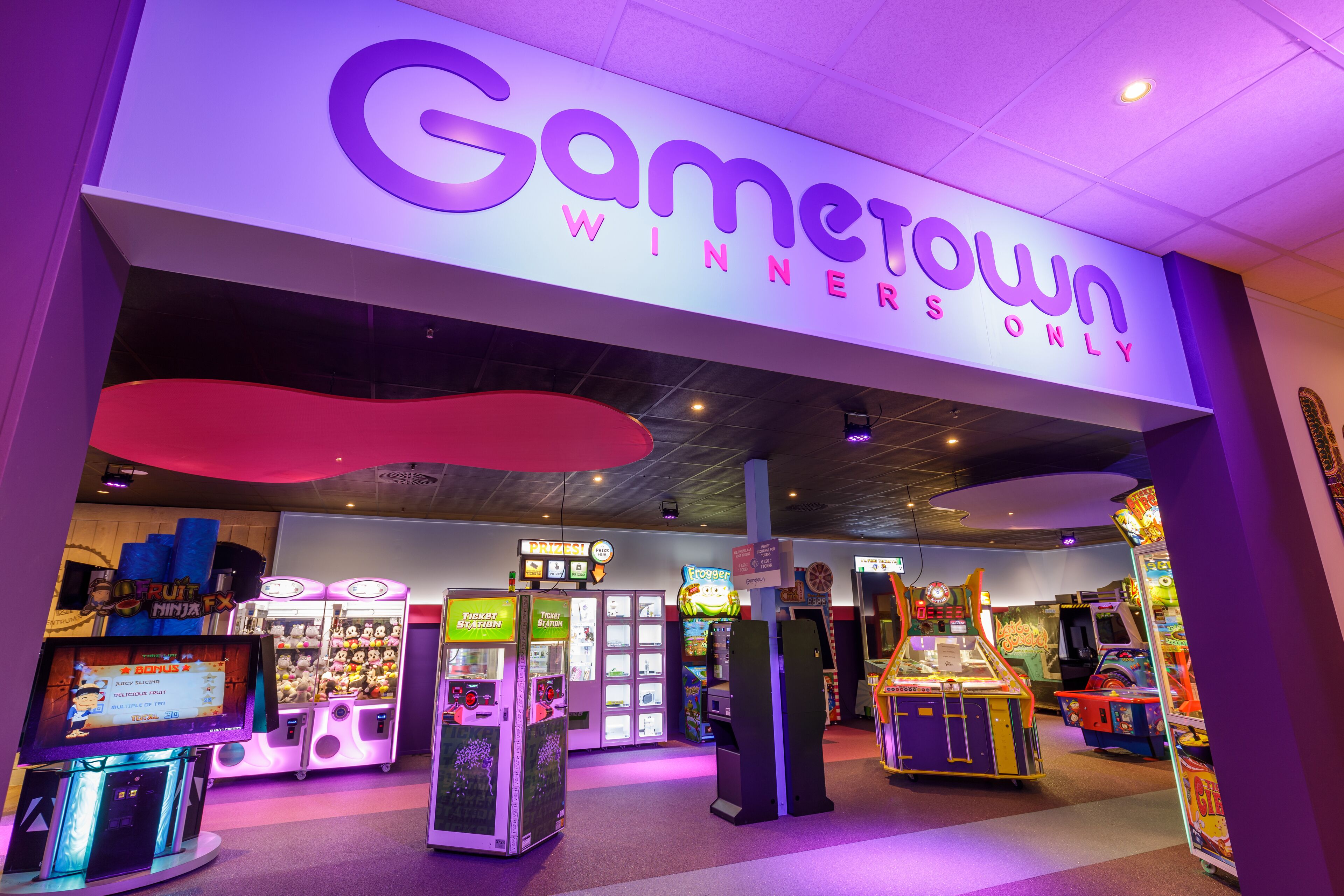 An arcade named Gametown with various gaming machines and a ticket station.