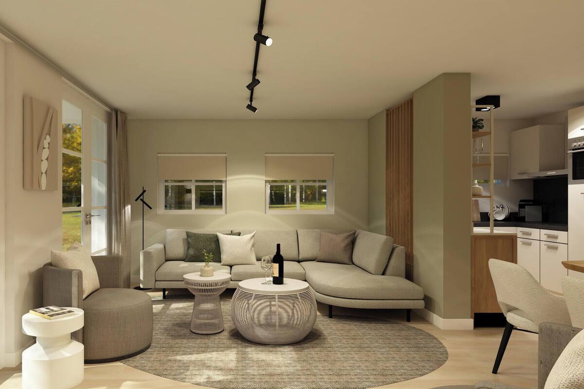 A modern living room with a sofa, coffee table, and ottoman, a kitchen area, and large windows with a view.