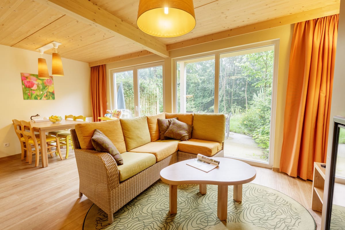 Premium cottage, 2 bedrooms | Living room | 80-cm TV with cable channels
