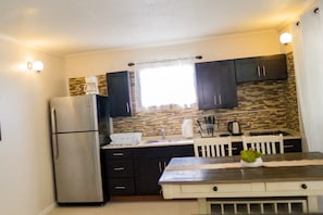 Apartment, 2 Bedrooms | Private kitchen | Electric kettle, paper towels - Palm Spring Inn (Oranjestad)