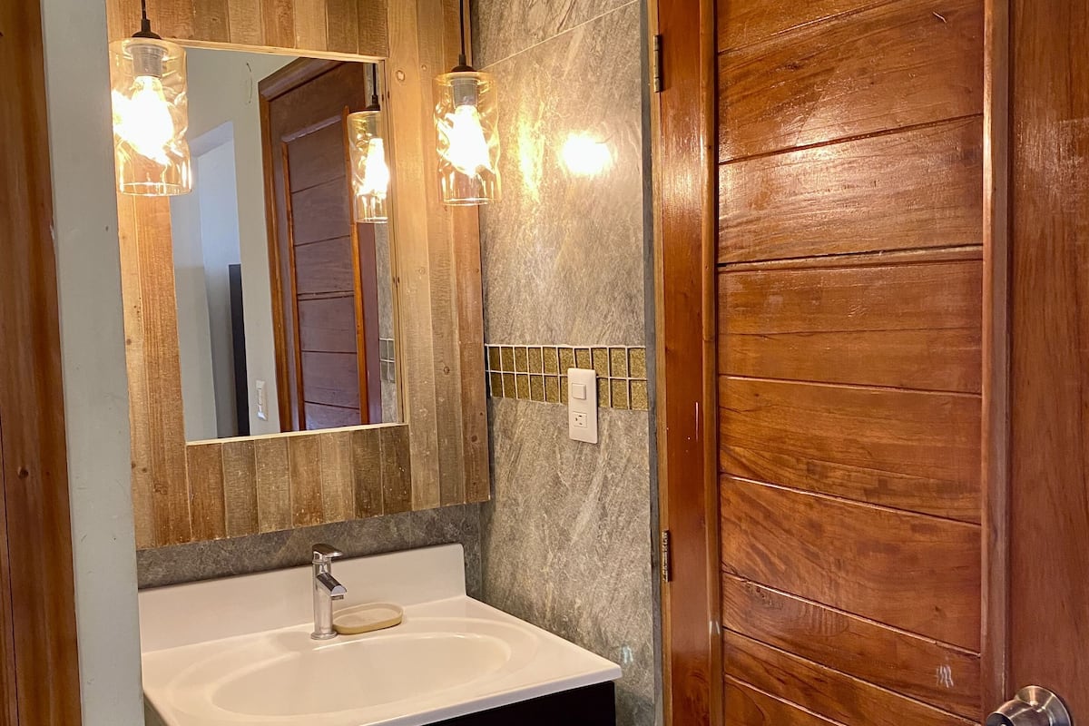 honeymoon room, 1 king bed, hot tub, ocean view | bathroom | shower, free toiletries, hair dryer, towels