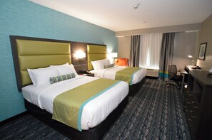 A hotel room with two beds, a desk, and a chair. - Holiday Inn Express And Suites Pasadena Houston Southeast by IHG (Pasadena)