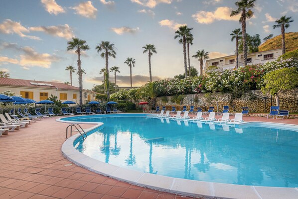 Seasonal outdoor pool, pool umbrellas, pool loungers