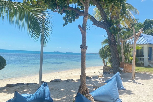 On the beach, white sand, beach umbrellas, kayaking
