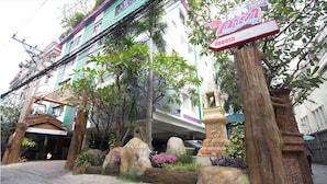 A building with a sign that reads "W 3" and "W 3". - Kaya Place (Bangkok)