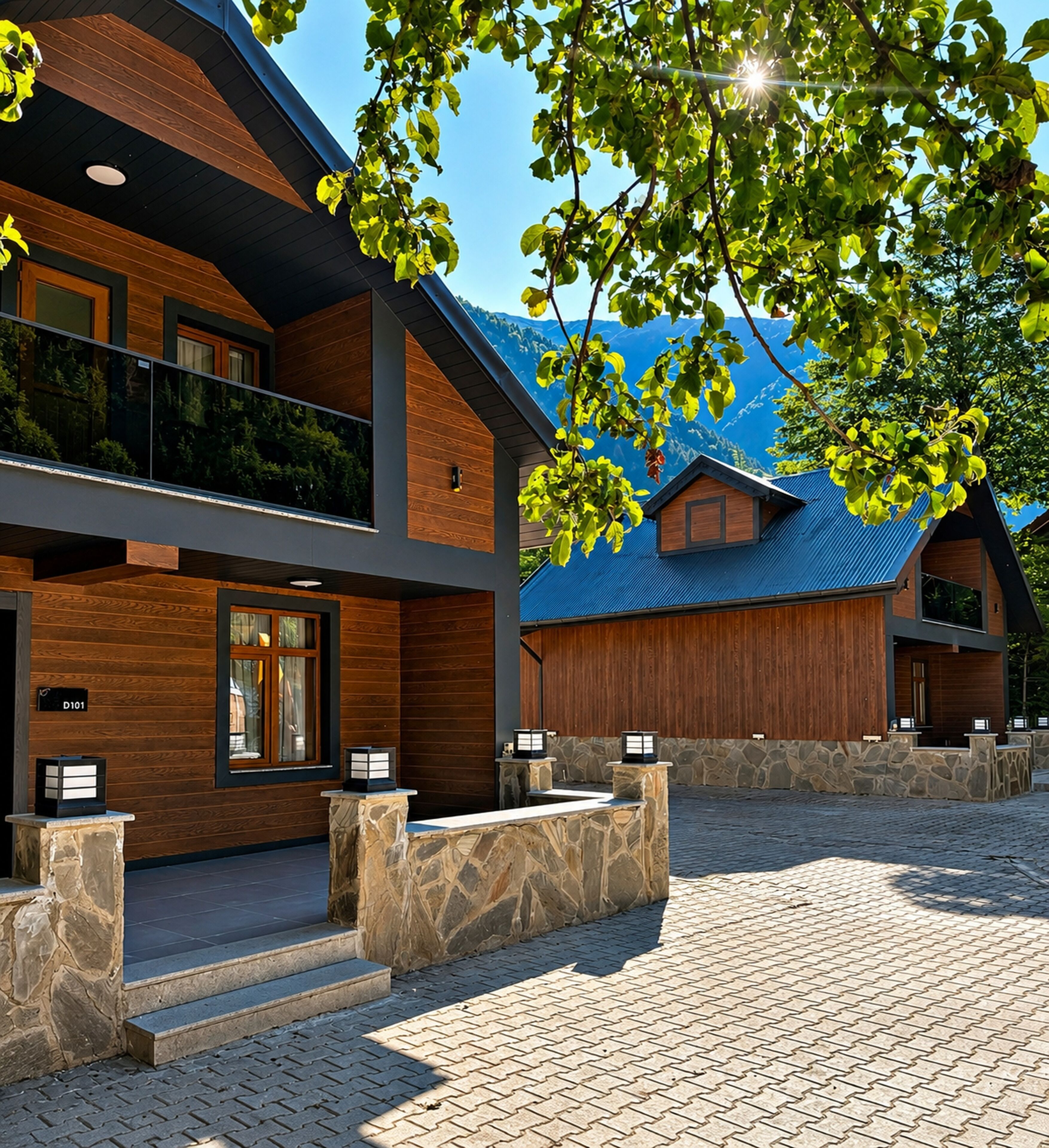 A modern building with a wooden facade, stone steps, and a balcony overlooking a mountainous area.