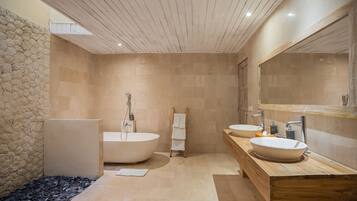 Separate bathtub and shower, free toiletries, hair dryer, slippers