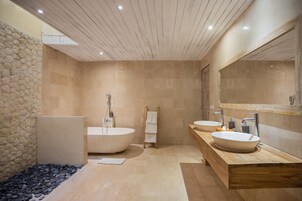 Separate tub and shower, free toiletries, hair dryer, slippers