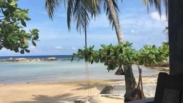 On the beach, sun-loungers, beach umbrellas, beach towels