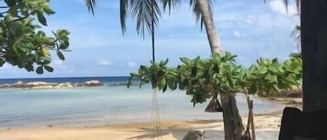 On the beach, sun-loungers