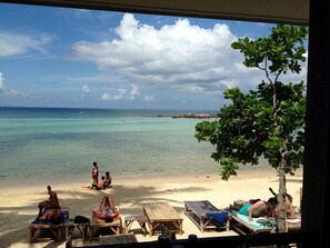 On the beach, sun-loungers, beach umbrellas, beach towels