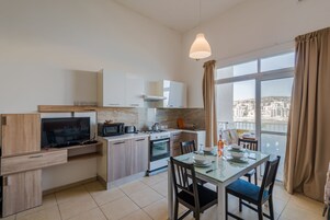 Panoramic Apartment, Sea View | Private kitchen | Full-size fridge, microwave, oven, stovetop
