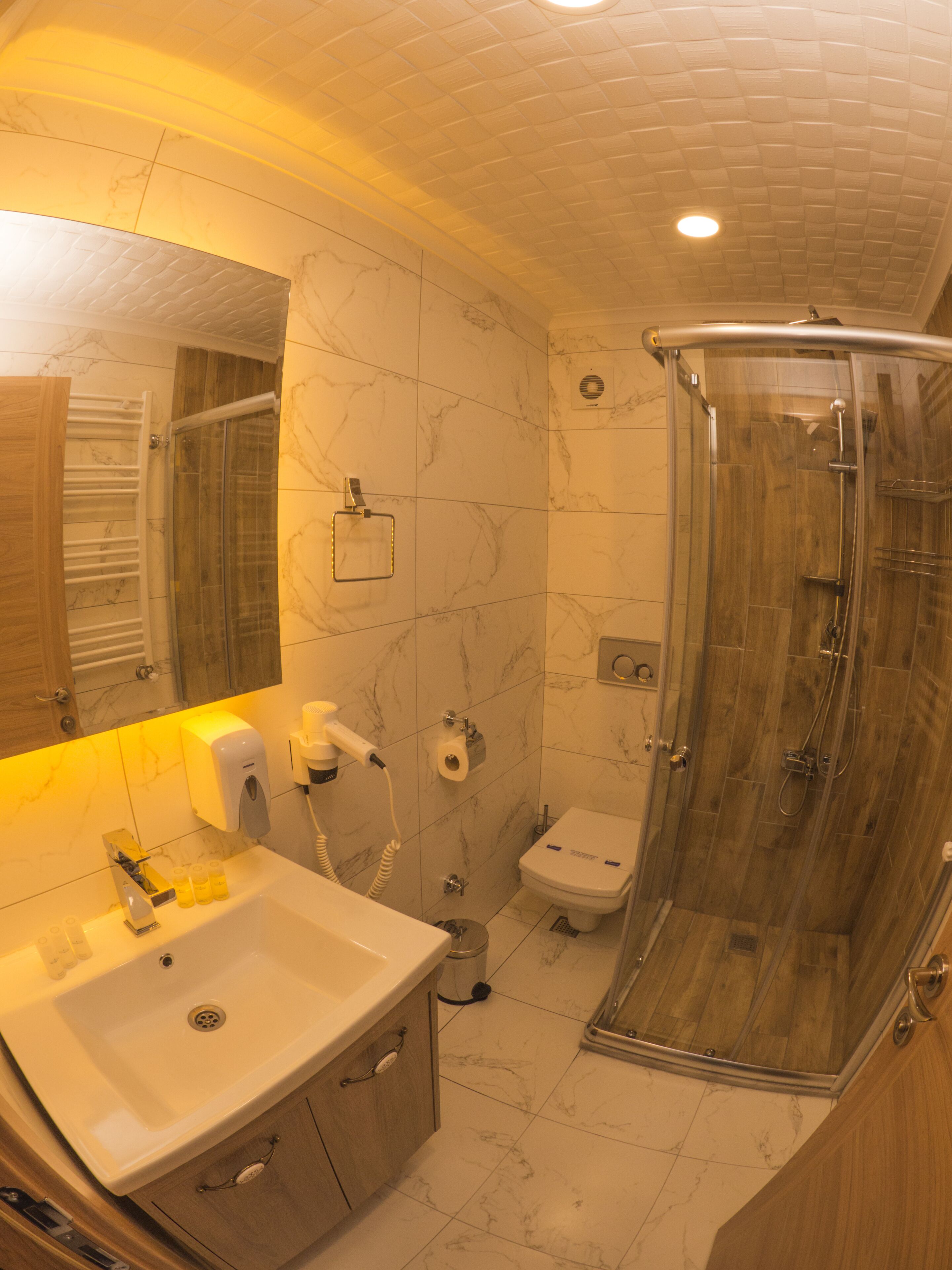 designer toiletries, hair dryer, slippers, heated floors