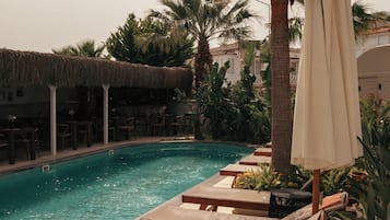 Seasonal outdoor pool, pool umbrellas, sun loungers