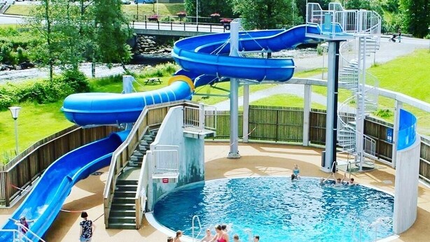 A water park with multiple slides and a central pool area. - Sauda Fjordhotell (Sauda)