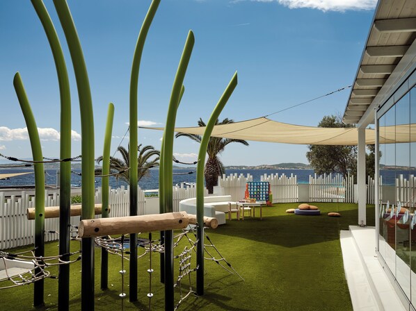 A children's play area with a rope bridge, climbing net, and soft play structures. - Eagles Villas - Small Luxury Hotels of The World (Aristotelis)