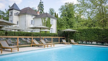 Seasonal outdoor pool, open 8:00 AM to 8:00 PM, pool umbrellas