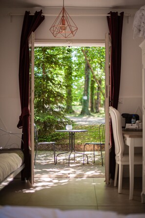 Family Triple Room, Park View, Garden Area | Terrace/patio