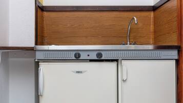 Mini-fridge, stovetop, high chair, cookware/dishes/utensils