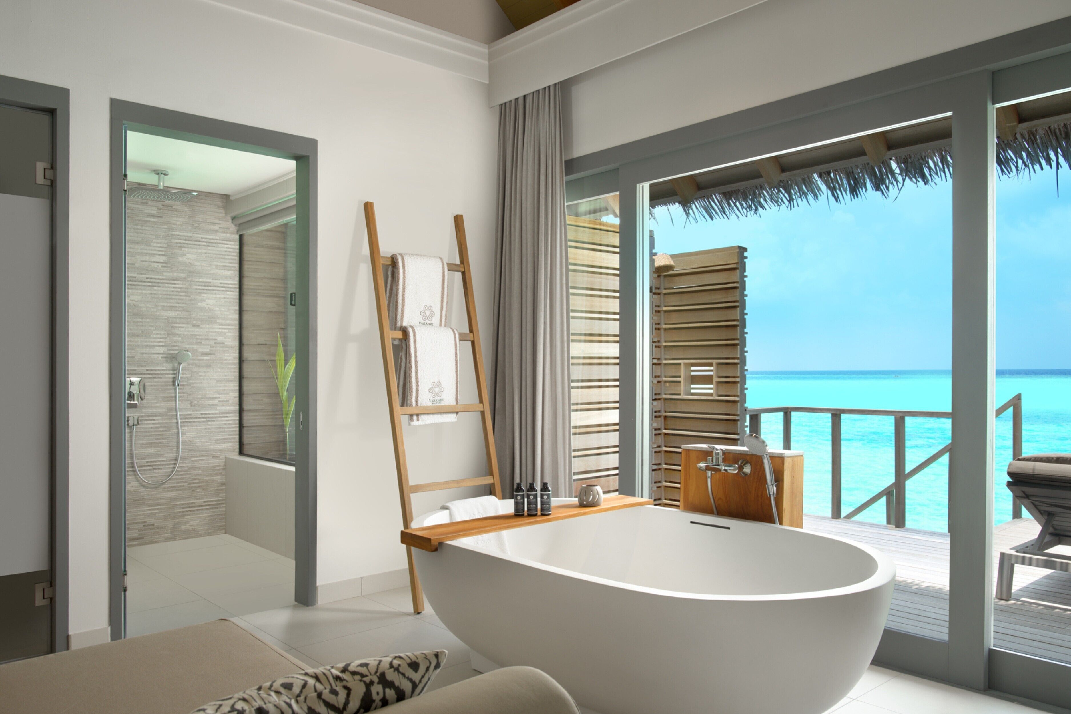 over water villa:30% off seaplane transfers, 11 jan to 19 dec 2025 stay | bathroom | separate bathtub and shower, rainfall showerhead, free toiletries