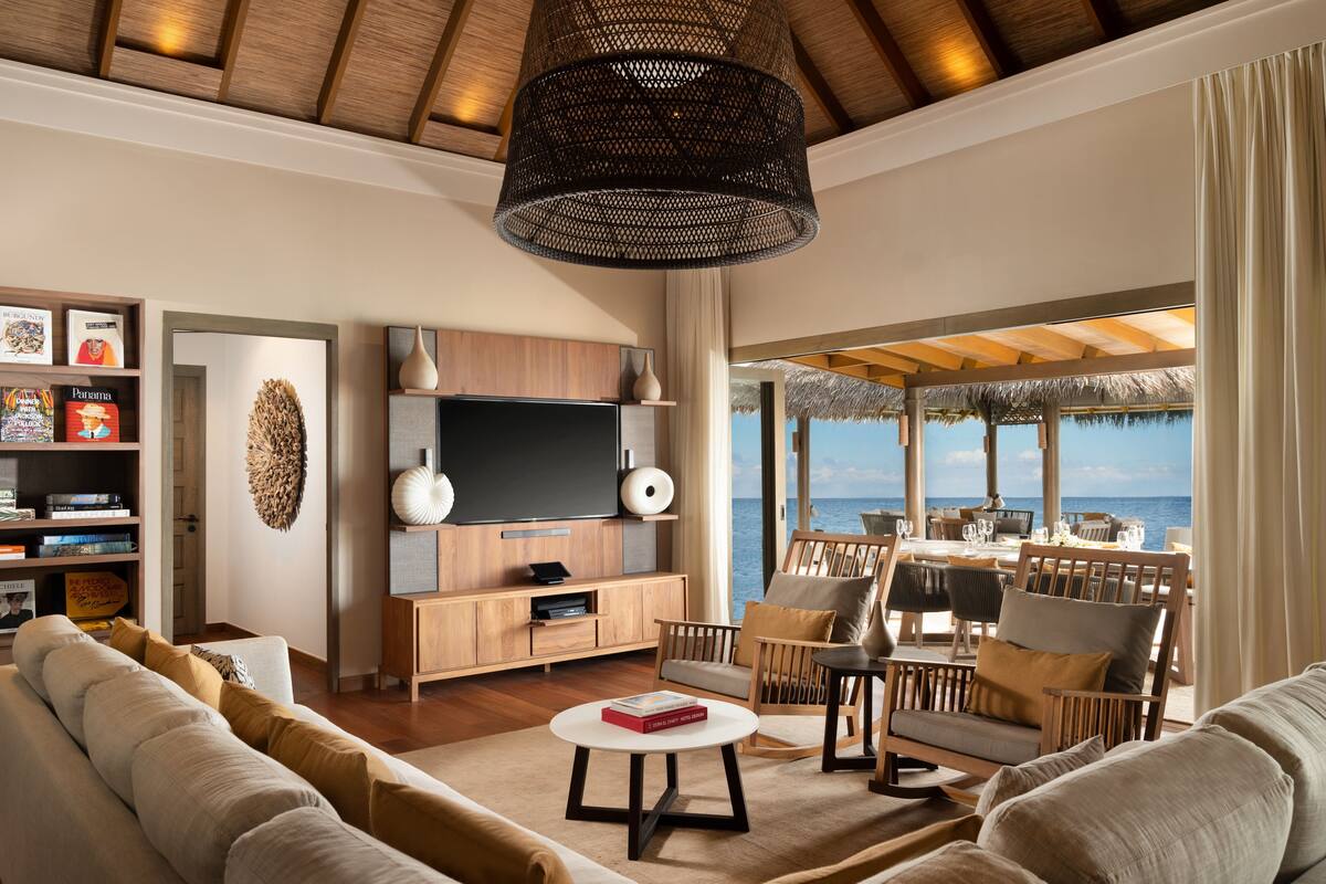 the vakkaru over water residence | living room | 42-inch flat-screen tv with cable channels, tv, table football