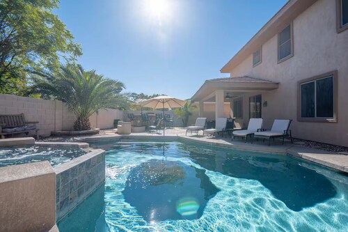 Custom home with 5 Beds & 5.5 Baths!  A heated pool & spa make the backyard feel like a resort