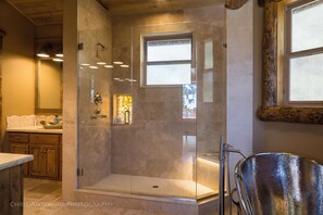 Bathtub, hair dryer, towels, soap