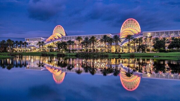 A hotel with two large, illuminated domes and a reflection in the water. - Minutes from Disney - Beautiful 3/2 Pool Villa with WiFi in Hampton Lakes  (Davenport)